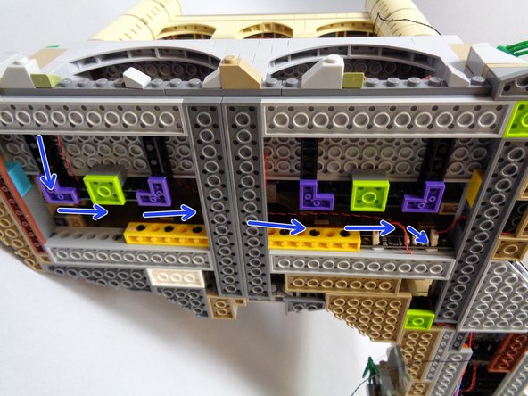 The blue arrows in the first photo show how your lantern wire should be routed beneath the castle base.