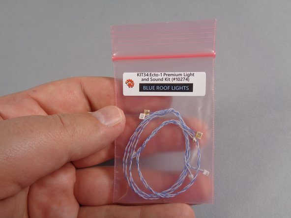 As shown in the second photo, open the large bag and find inside a smaller bag labeled &quot;Blue Roof Lights.&quot;  This is the bag you will be using first.