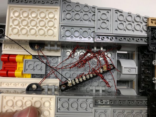 Depending on when your kit was manufactured, the BRANCH10 adapter supplied may have either side-facing or top-facing connectors.  The LED lights will still connect the same way.  Note that your kit may also have a BRANCH10 adapter with 12 small plugs.