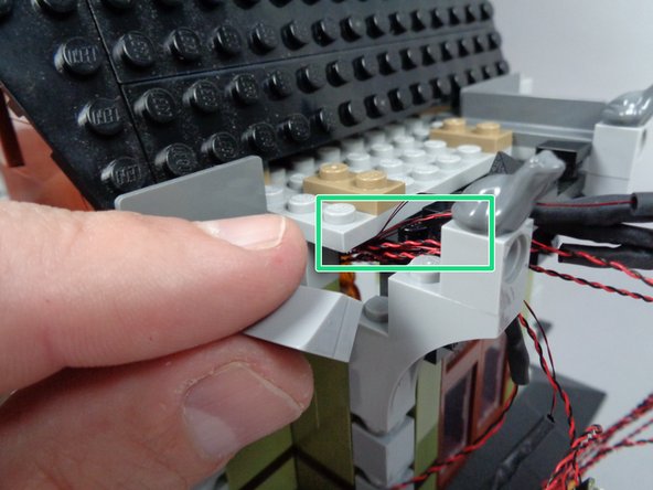 As shown in the three photos for this step, you can now re-assemble the wall sections you might have disassembled earlier to make room for the light wires.
