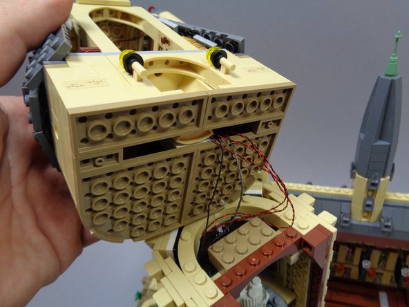 Finish re-attaching the dark tan parts as shown in the third photo.