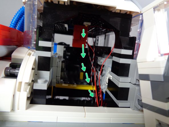 The green arrows show the path both of these wires will take.