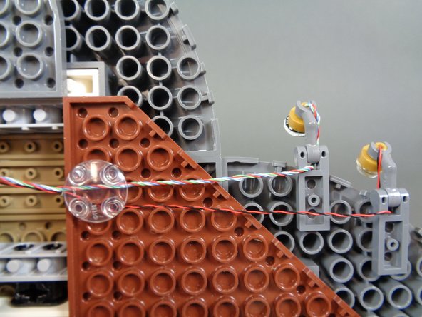 Now you will clean up the wiring underneath the castle and hide any excess wire.