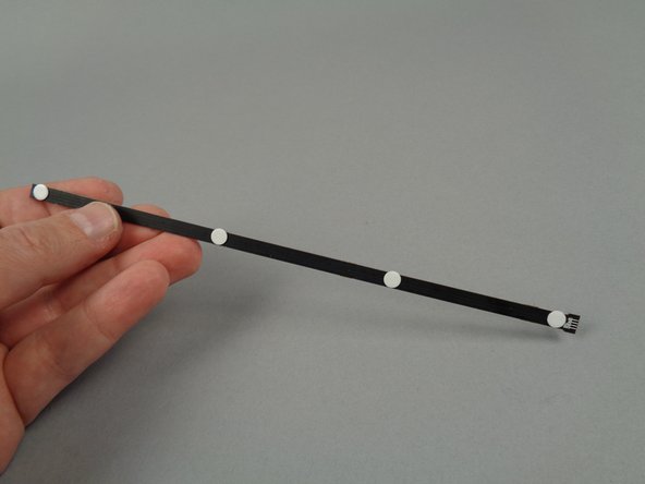 Use only four sticky dots per light strip, spacing them evenly along the length of each strip as shown in the third photo.  Your Brickstuff kit includes enough sticky dots for all light strips.