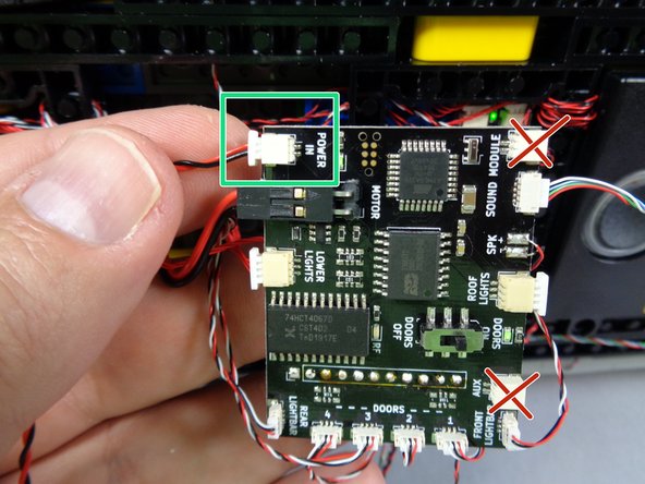 As shown by the green rectangle in the first photo for this step, you can now connect power to the POWER IN plug on the main controller.