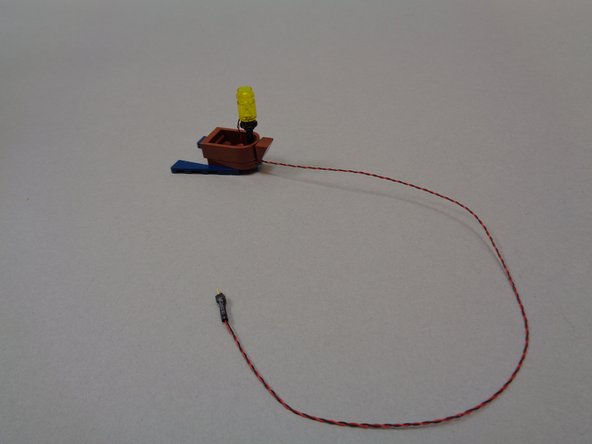 The third photo shows what your finished boat should look like after installing the lantern with light inside.