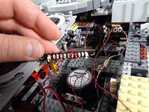 The first photo in this step shows the BRANCH10 adapter board in the right rear section of your Falcon.  This is where the five interior lights should be connected, from when you first installed your original light and sound kit.