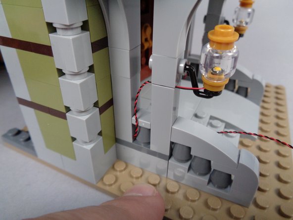Continue routing the wire for the second front porch light as shown in the photos for this step.