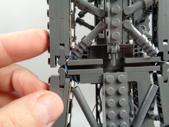 As shown in the photos for this step, you can use the tweezers to tidy up any visible sections of wire connecting the 17-LED sections and 20-LED sections of both light strips.