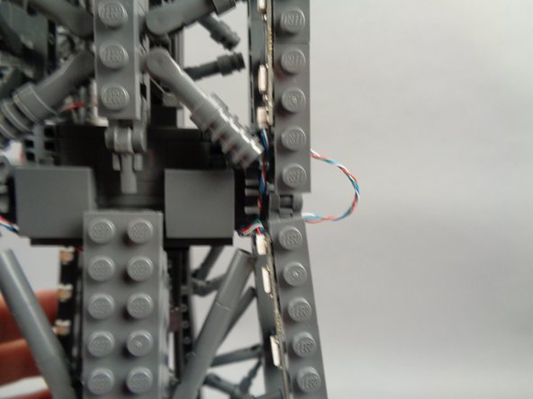 As shown in the photos for this step, you can use the tweezers to tidy up any visible sections of wire connecting the 17-LED sections and 20-LED sections of both light strips.