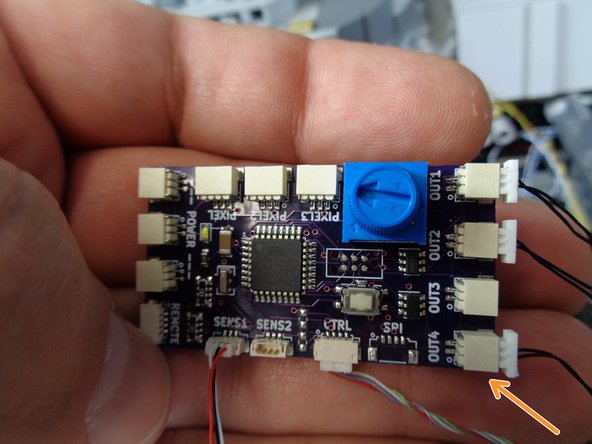 The photos show the two different versions of TRUNK08 master controller that could be included with your kit.  Refer to the photo that matches the TRUNK08 you received with your kit.