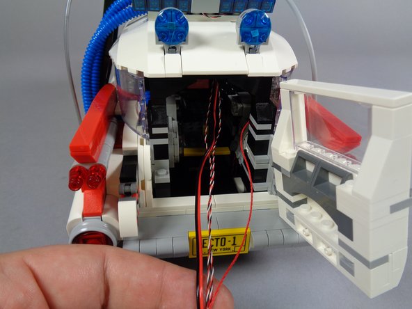 Next, you will pass the four wires coming from the roof section down to the underside of the vehicle frame.