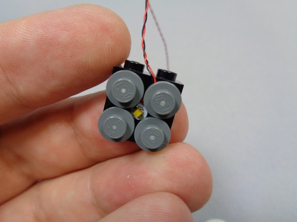 Remove the clock face from its bracket.