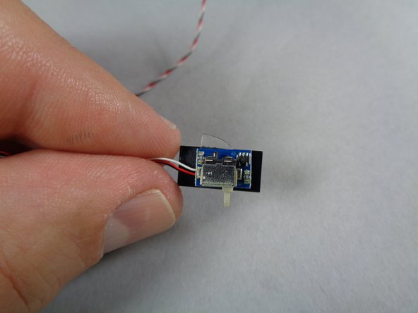 As shown by the green line in the first photo, make sure the edge of the glue disc does not extend beyond the front edge of the tile.