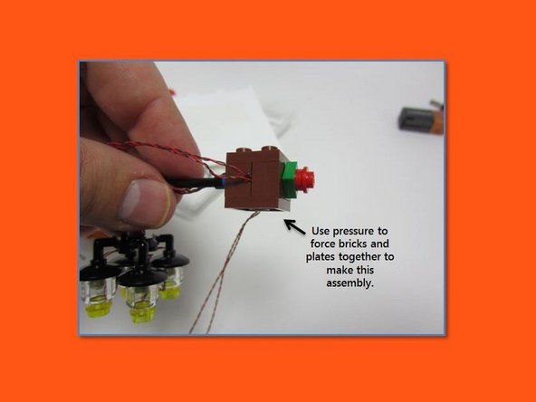 In steps 47-49 of the building instructions, mount the chandelier as shown in the photos, and use the modified plate elements to route the wires as shown.