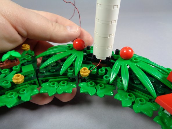 The third photo shows how you will begin wrapping the LED light wires in the next step.