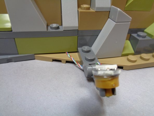 The three photos in this step show various ways to mount the spotlights.