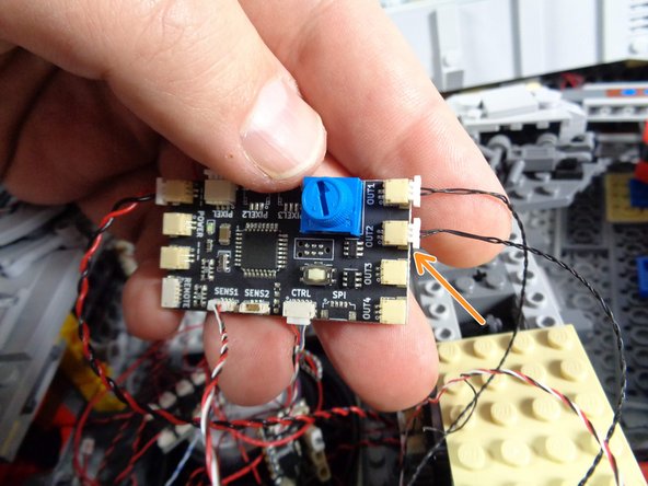 Be very careful when removing these wires from the connectors on the TRUNK05 controller.  The plugs can grip the connectors very tightly, and you can rip out a wire if you pull from the wire to disconnect.  Make sure you pull only on the white plug and its tabs.  Use a tweezers if necessary to loosen the plug from its socket.