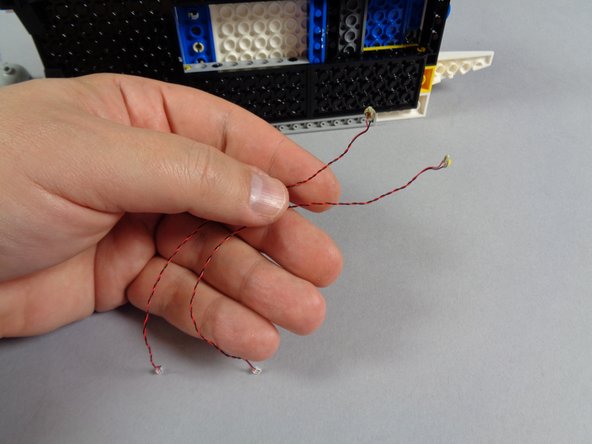 Inside your &quot;Roof Parts&quot; bag, there should be two more warm white Pico LED lights with shorter cables.  These are shown in the first photo for this step.