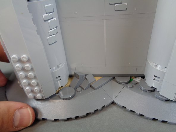 As shown in the first photo for this step, you should now have all rockwork pieces re-attached.