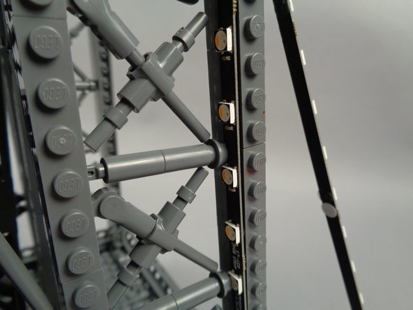 As shown in the photos for this step, you will need to adjust cross-brace elements in the tower frame to make room for the LEDs and strips to fit.