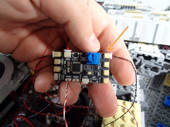 Be very careful when removing these wires from the connectors on the TRUNK05 controller.  The plugs can grip the connectors very tightly, and you can rip out a wire if you pull from the wire to disconnect.  Make sure you pull only on the white plug and its tabs.  Use a tweezers if necessary to loosen the plug from its socket.