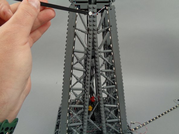 Leave the top LED strip section (the 20-LED strip) hanging loose for now as shown in the second photo).