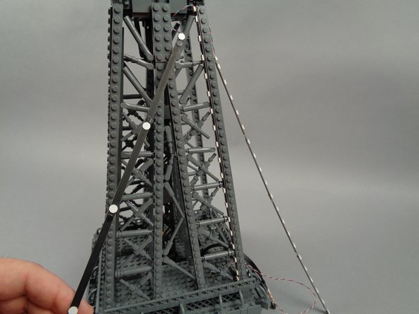 Leave the top LED strip section (the 20-LED strip) hanging loose for now as shown in the second photo).