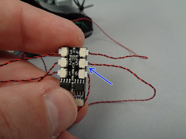 As shown by the arrow in the third photo for this step, connect the LED light to the last open plug on the BRANCH06X driver board (plug #5).