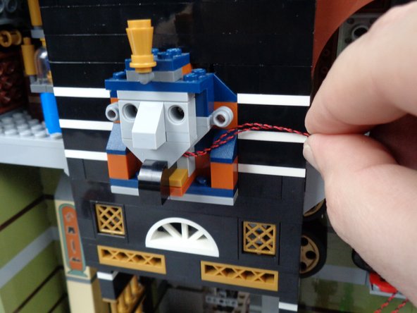 After you have re-attached the face, your wires should look like the setup in the third photo for this step.