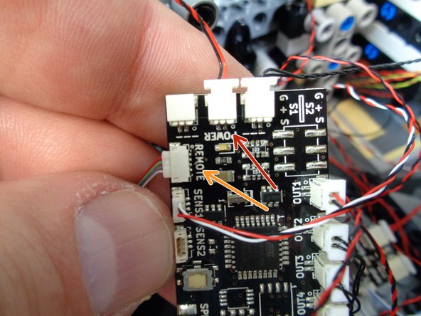 As shown in the first photo for this step, the remote receiver has two wires with two different plugs: