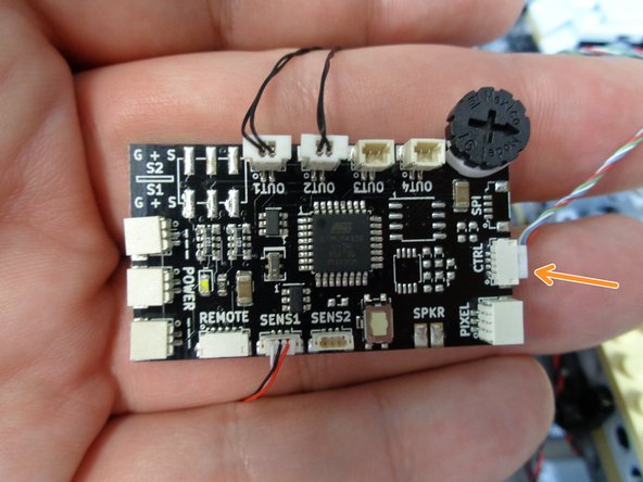 As shown in the photos for this step, connect the &quot;laser&quot; sound module's 4-wire control cable to the plug labeled &quot;CTRL&quot; on your TRUNK08 master controller.