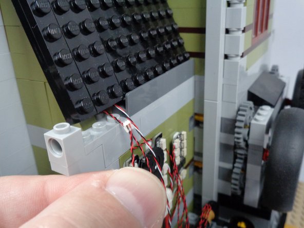 As shown by the orange circle in the third photo for this step, connect the skull jar LED light to plug #4 on the BRANCH06X adapter board.