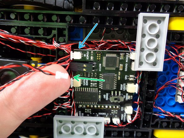 If you have connected the USB cable to the POWER IN plug on your main controller (blue arrow in the first photo), disconnect that and replace it with one end of the heavy-duty connecting cable included with your LiPo power source (green arrow).