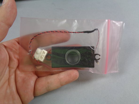 Your Ecto-1 kit has two speakers.  The larger speaker is where all of the built-in sound effects play.  The smaller speaker, which you will install later, is where your custom sounds, music, and quotes play.