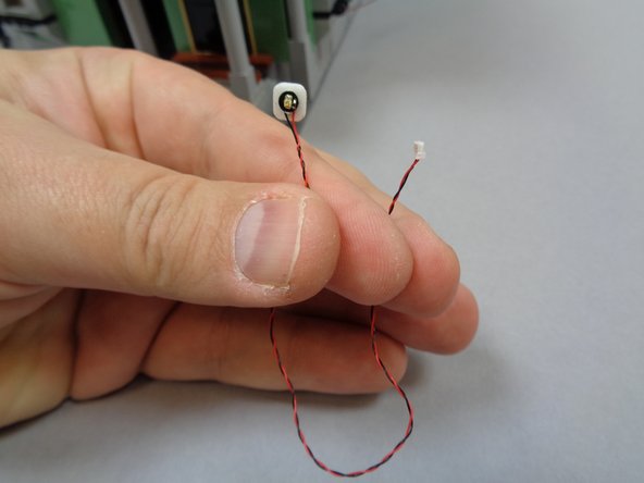 Take the last yellow Pico LED light with 6&quot; (15.2cm) wire and attach a small sticky square to the back.