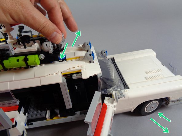As shown by the red arrow in the first photo for this step, carefully and slowly re-insert the steering axle, feeling for anything preventing the axle from inserting all the way.