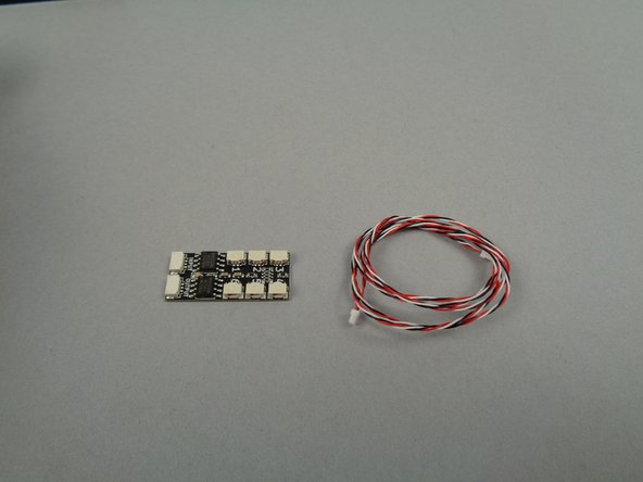 As shown in the first photo for this step, remove the third BRANCH06X driver board and 3-wire connecting cable from their pink bag.