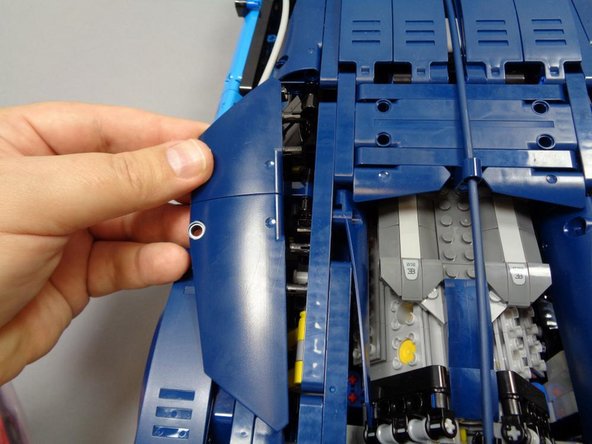 As shown in the first photo, carefully remove the Technic panels on the left rear of the Bugatti.