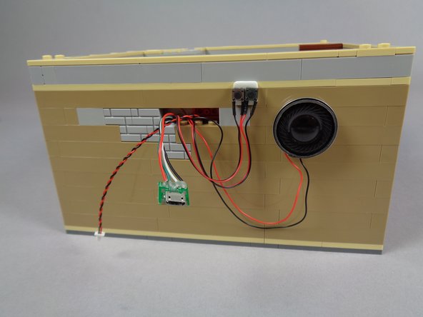 You don't have to attach the buttons this way-- you could leave them hanging loose or conceal elsewhere in the cinema.