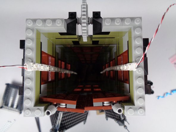 The first and second photos for this step show how your light strips should look once fully mounted inside the full length of the tower.