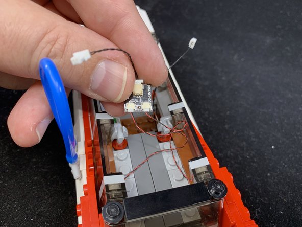 As shown in the third photo, connect the two tail lights to the small connectors on the BRANCH03 adapter board.