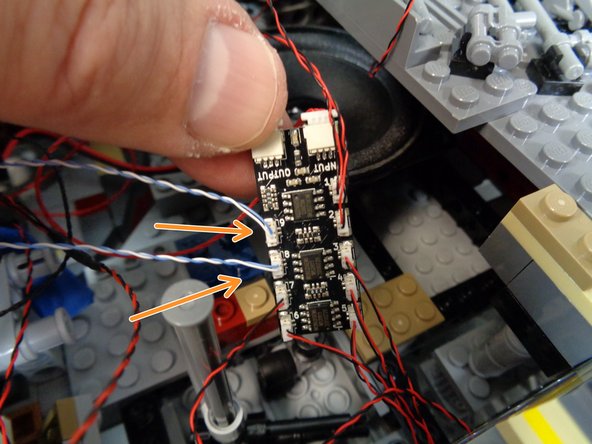 As shown in the third photo, connect the two laser cannon light wires to plugs #8 and #9 on the second BRANCH09X adapter board.