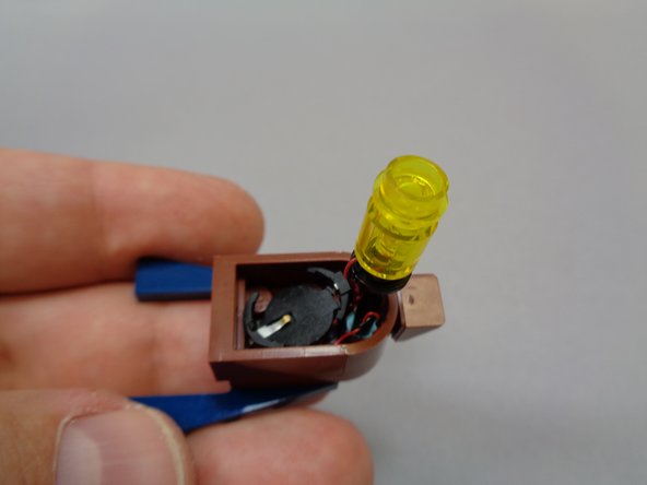 As shown in the first photo, test-fit the boat frame to make sure the battery pack is positioned to allow enough room for the frame to re-attach.