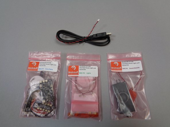 The photos for this step show the parts included with your kit.  As shown in the first photo, there are three main bags and one USB cable.