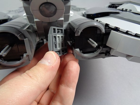 As shown by the first photo in this step, carefully remove the parts that form the inner engine shell.  Do this for both the left and right engines.