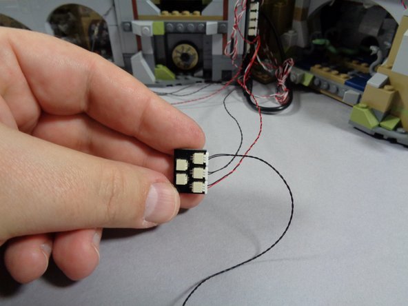 Behind your castle, you should have a BRANCH18 adapter with five plugs from when you installed the main light and sound kit.  There should be two open plugs on the BRANCH18 adapter board.