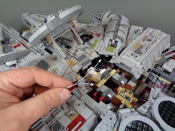 Now you will connect the two laser cannon light wires.