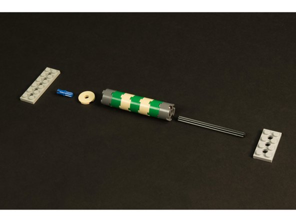 The two plates with holes will hold the axle of the cylinder in place at the top and bottom.