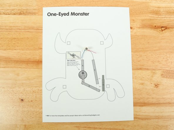 Stick the motor to the double sided tape making sure the back of the motor (with the wires) is stuck down to the tape and the part that spins faces upwards so it can move freely.